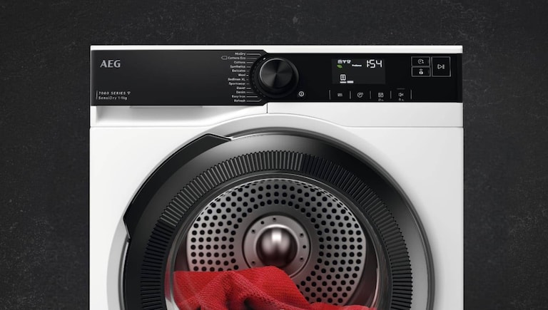 AEG tumble dryer containing a red fabric.